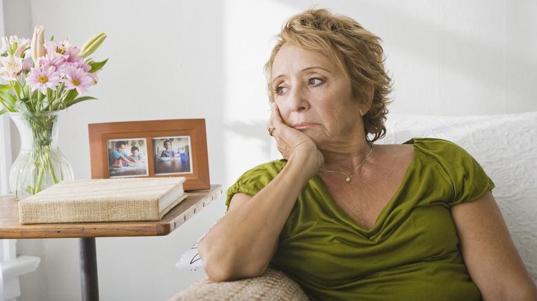 Older woman looking thoughtful