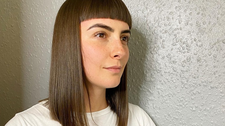 Woman with blunt bangs