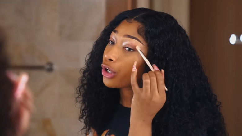 Megan Thee Stallion applying eyeshadow