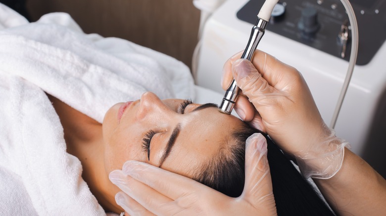 A woman getting a microdermabrasion procedure done
