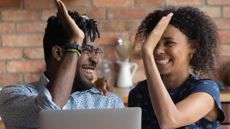 couple celebrating financial success