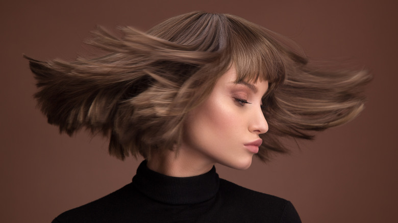 Woman with short brown hair 