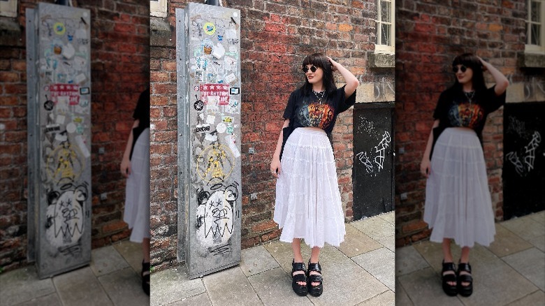 Girl wearing band tee with maxi skirt.