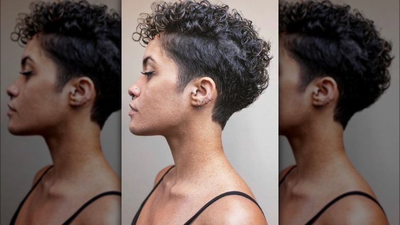 Curly-haired woman with undercut