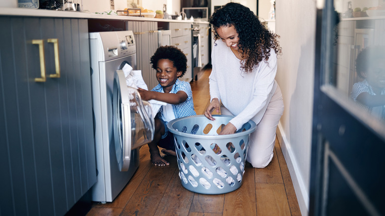 family using clothes dryer