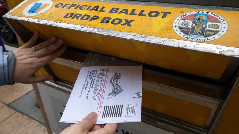 Putting ballot into drop box