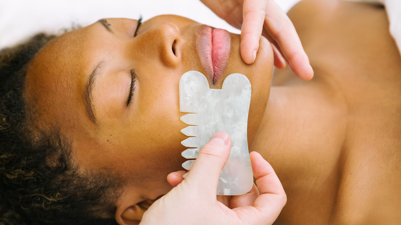 woman receiving gua sha treatment