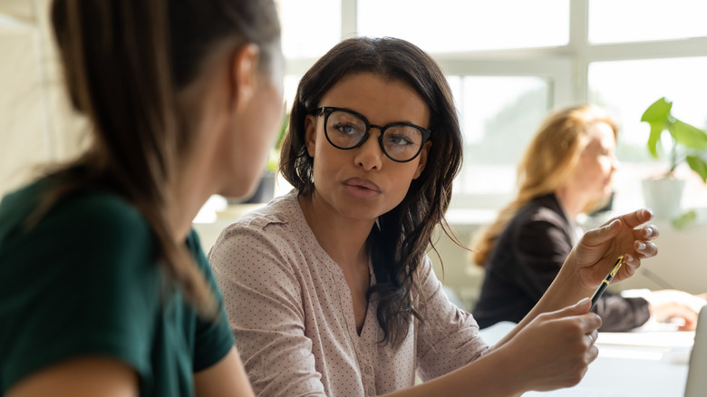 Two women talking at work