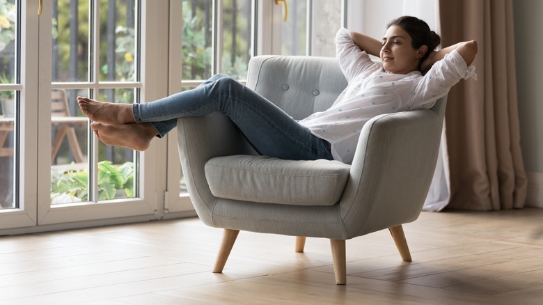 Woman sleeping on chair