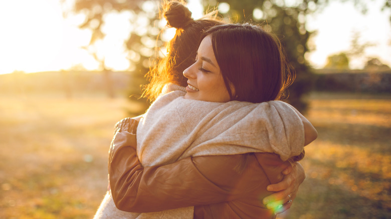 Two friends hugging