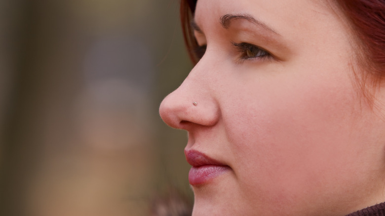 A woman with a nose piercing
