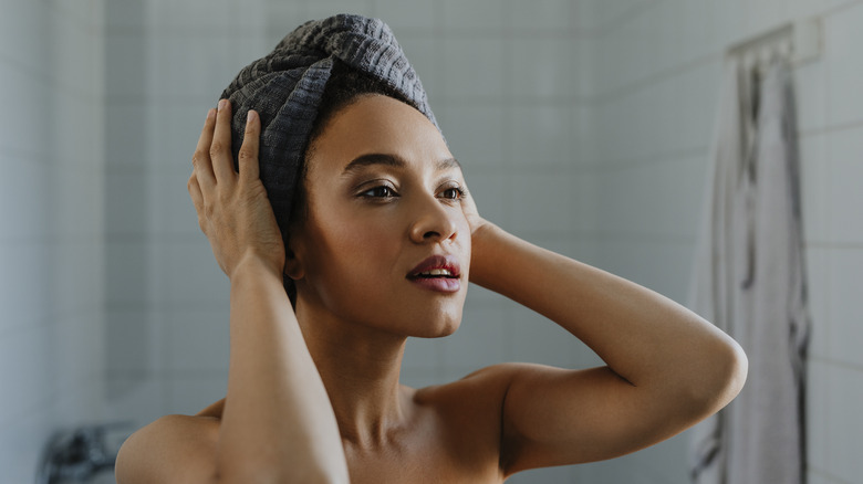 Woman using a microfiber hair towel