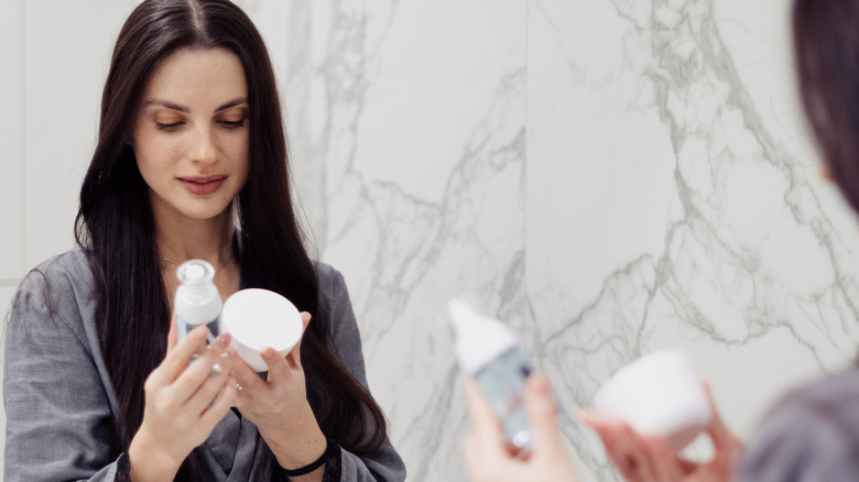 Woman looking at skincare