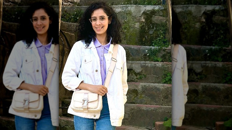 Woman wears digital lavender polo with white denim jacket