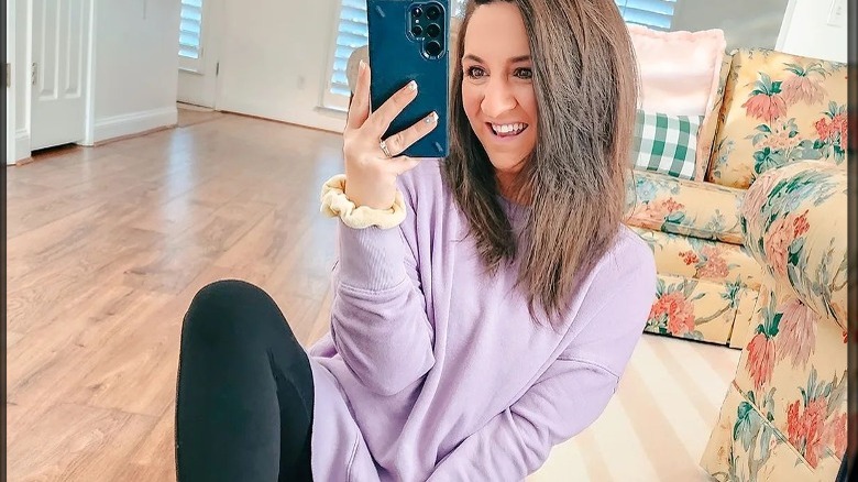 Woman wears digital lavender sweatshirt 