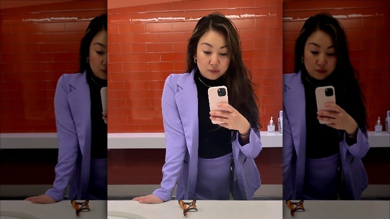 Woman wears digital lavender suit