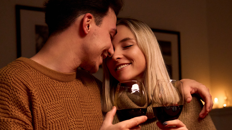 romantic couple toasting with wine