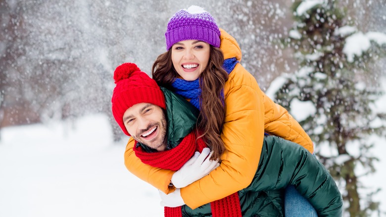 Couple embracing in snow