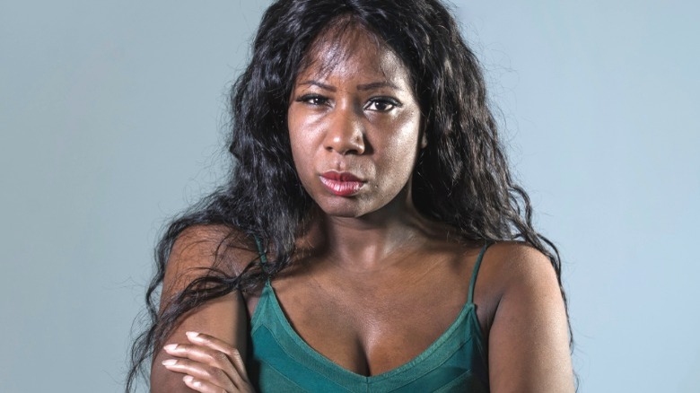 Frowning, judgmental Black woman