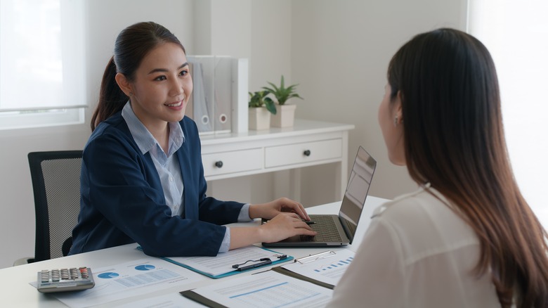 Woman talking to boss