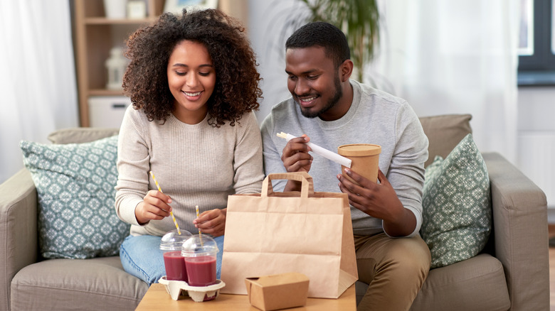 couple with takeout food