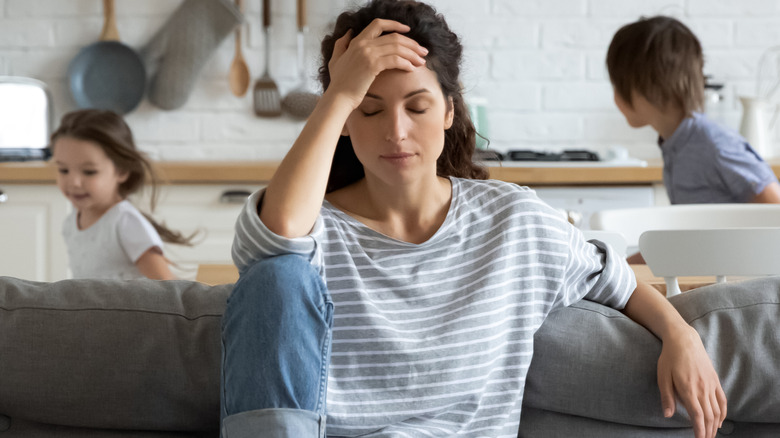 frustrated woman sitting on sofa