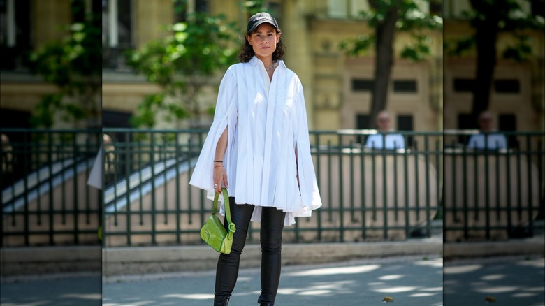 woman holding green bag