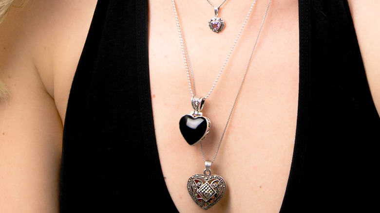 Woman with layered heart necklaces