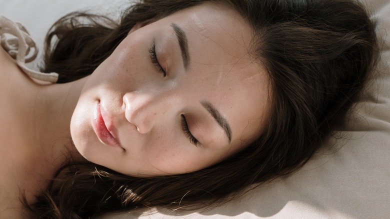 female sleeping on a pillow