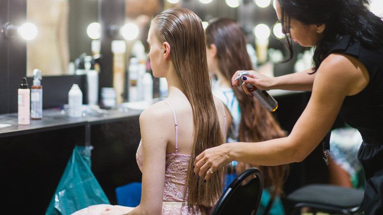 woman having hair styled