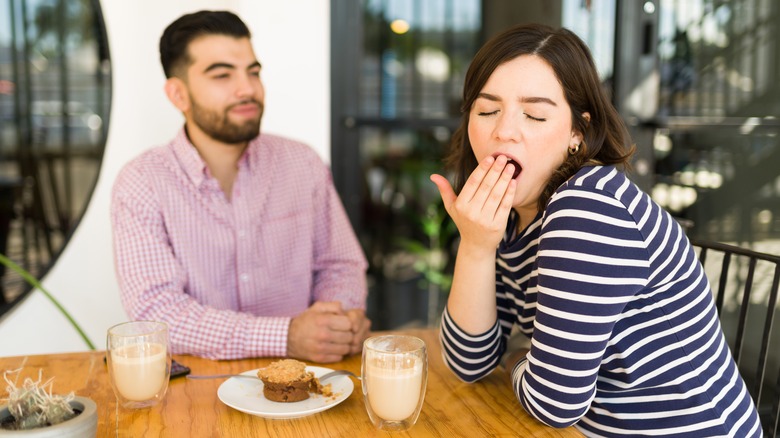 person yawning on date