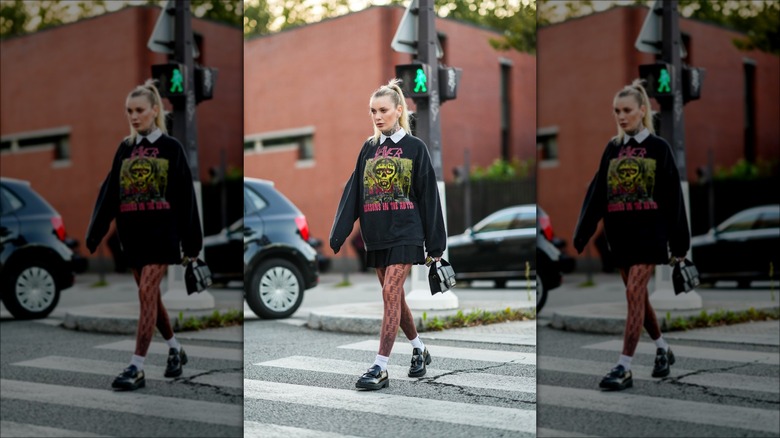 woman wearing graphic sweatshirt