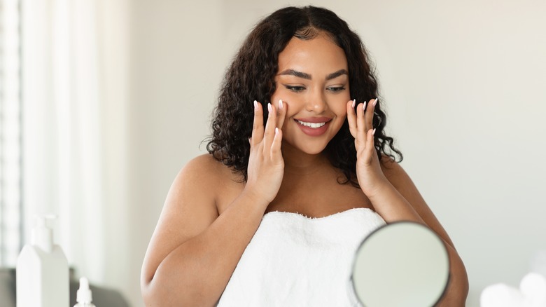 Woman smiling at mirror