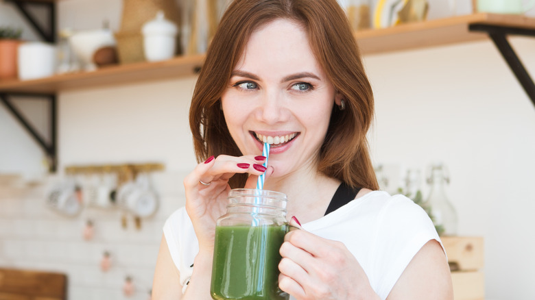 female drinking smoothie