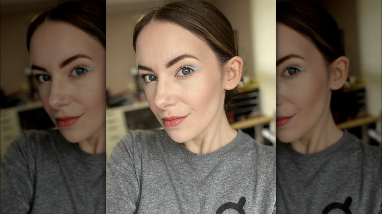 A woman with light blue eyeliner