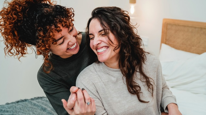 same sex couple smiling