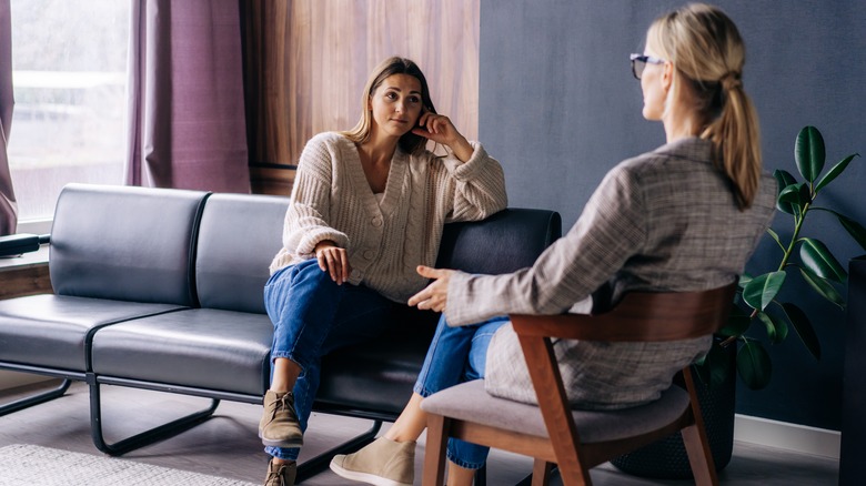 Woman talking to female therapist