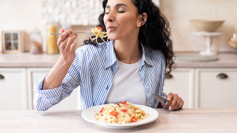 Woman eating alone