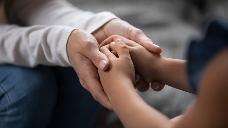 Couple holding hands