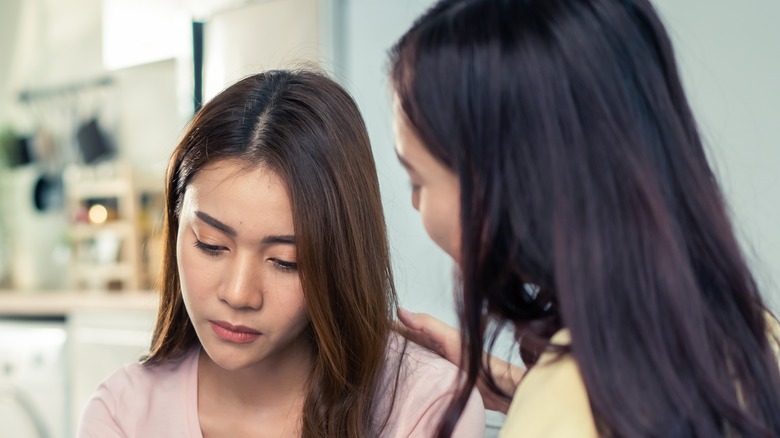 woman crying with friend