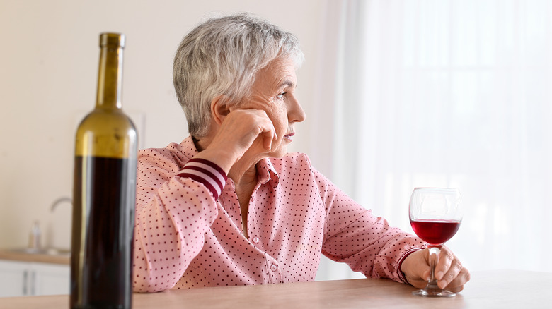 stressed out woman with wine