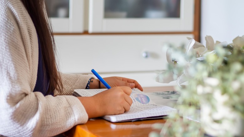 Woman writes in journal