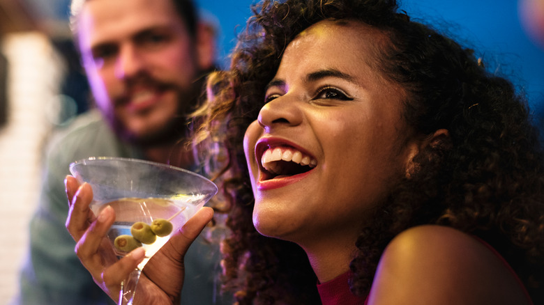 woman drinking martini