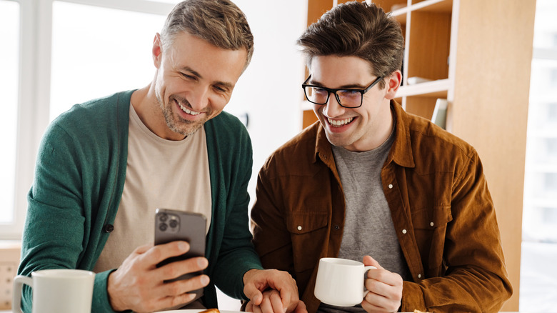 young gay couple laughing together