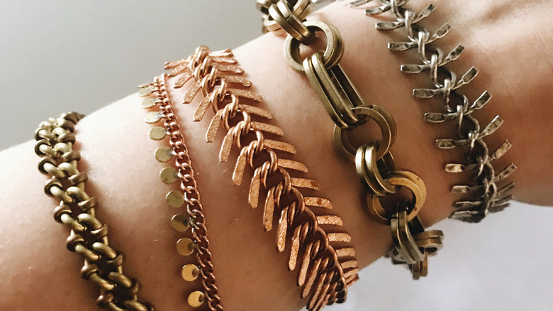 Wrist with mixed metal bracelets