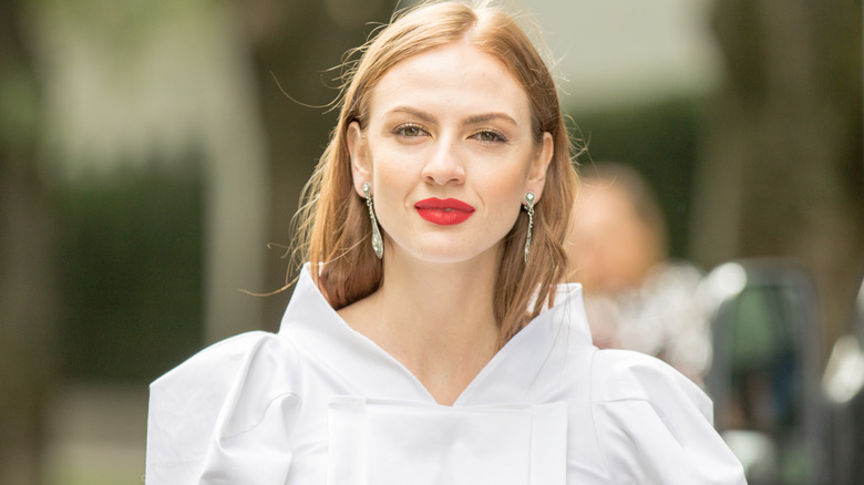 Woman in white with red lips 