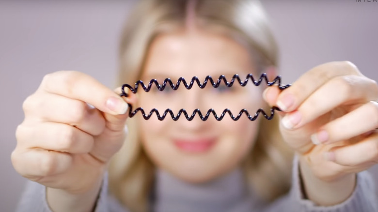 A woman picking out a scrunchie