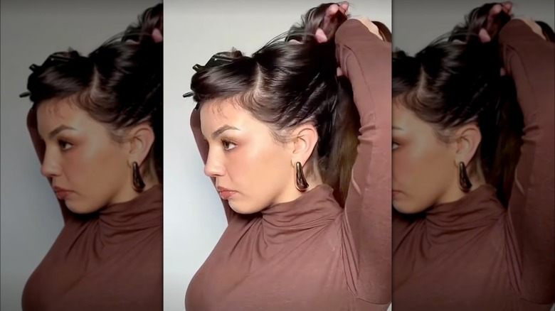 A woman touching her hair