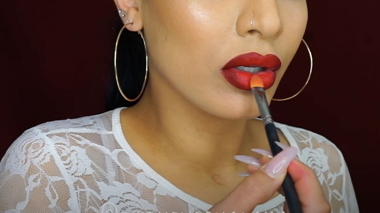 woman blending ombre lip