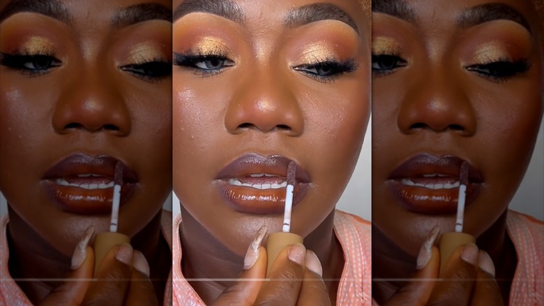 woman applying ombré lip